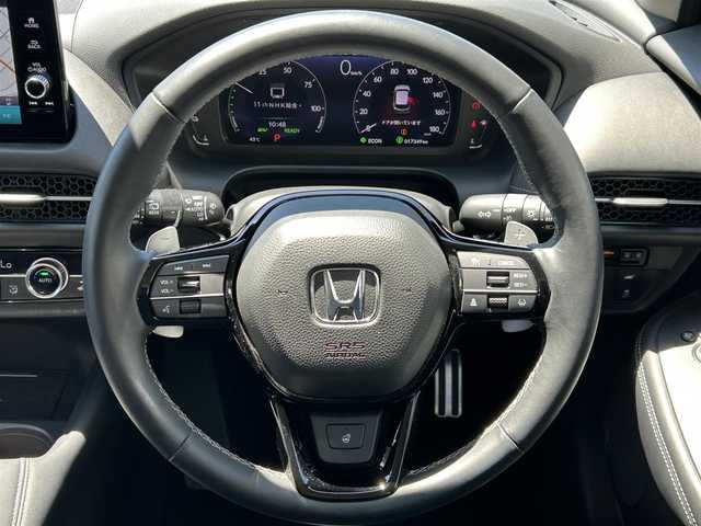 ホンダ ＺＲ－Ｖ ハイブリッド e:HEV Z 愛媛県 2023(令5)年 1.8万km スーパープラチナグレーメタリック 登録時走行距離：17348Km/メーカーオプション純正ナビ/フルセグTV/Bluetooth/全周囲カメラ/前後ドライブレコーダー/ビルトインETC2.0/横滑り防止装置/レーンキープアシスト/レーダークルーズコントロール/LEDヘッドライト/オートライト/エンジンスタートボタン/スマートキー/純正フロアマット/本革シート/ステアリング/オートホールド/BOSEスピーカー/シートーヒーター/ワイヤレス充電/電動リアゲート