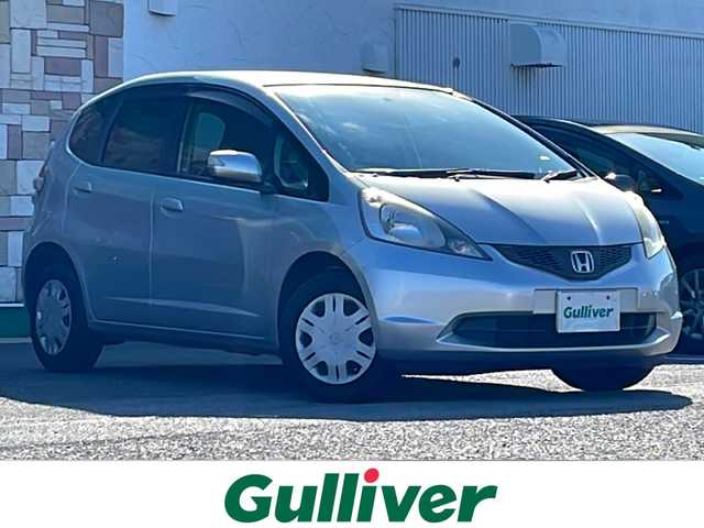 ホンダ フィット G 徳島県 2010(平22)年 6.7万km アラバスターシルバーメタリック 7型社外SDナビ　AVN119M/（ラジオ/CD/ワンセグ/iPod）/ETC/キセノンヘッドライト/純正フロアマット/ウィンドロック/レベライザー/純正14インチアルミホイール/電動格納ミラー/リモコンキー/取扱説明書/新車時保証書