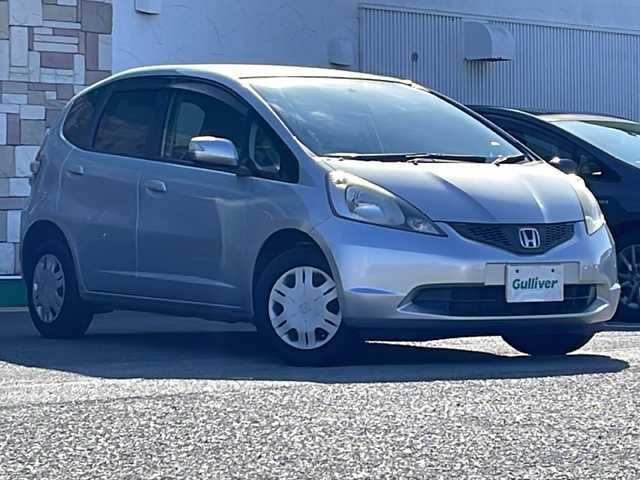 ホンダ フィット G 徳島県 2010(平22)年 6.7万km アラバスターシルバーメタリック 7型社外SDナビ　AVN119M/（ラジオ/CD/ワンセグ/iPod）/ETC/キセノンヘッドライト/純正フロアマット/ウィンドロック/レベライザー/純正14インチアルミホイール/電動格納ミラー/リモコンキー/取扱説明書/新車時保証書