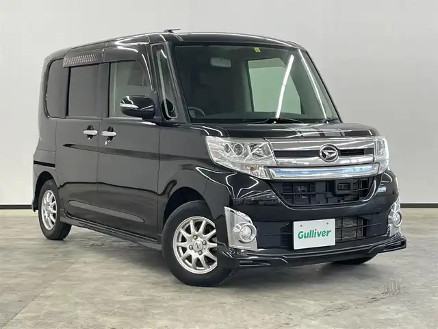 ダイハツ タント カスタム RS SA 長崎県 2014(平26)年 3.2万km ブラックマイカメタリック 純正8インチナビ　（NSZN‐W64DB）/・フルセグTV　CD/DVD/SD/Bluetooth/スマートアシスト/・衝突軽減ブレーキ/・踏み間違い防止装置/バックカメラ/両側パワースライドドア/LEDヘッドライト/フォグランプ/プッシュスタート/スマートキー/アイドリングストップ/横滑り防止装置/ステアリングスイッチ/ETC/後席サンシェード/社外13インチAW/純正フロアマット