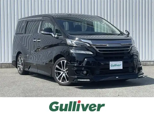 トヨタ ヴェルファイア Z Aエディション 福岡県 2017(平29)年 3万km ブラック ・TRDエアロ/・純正ナビ10インチ【NSZN-Z66T】/-BT/フルセグTV/CD/DVD/SD/FM/AM/・バックカメラ/・純正フリップダウンモニター12.1インチ[V12T-R68C】/・電動パーキングブレーキ/・ブレーキホールド/・クリアランスソナー/・純正フロアマット/・TRDアルミ19インチ/・両側パワースライドドア/・クルーズコントロール/・オートライト/・ビルトインETC/・ドアバイザー/・ウィンカーミラー/・ステアリングリモコン/・電動格納ミラー/・プッシュスタート/・スマートキー/・禁煙車