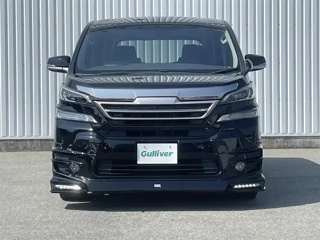 トヨタ ヴェルファイア Z Aエディション 福岡県 2017(平29)年 3万km ブラック ・TRDエアロ/・純正ナビ10インチ【NSZN-Z66T】/-BT/フルセグTV/CD/DVD/SD/FM/AM/・バックカメラ/・純正フリップダウンモニター12.1インチ[V12T-R68C】/・電動パーキングブレーキ/・ブレーキホールド/・クリアランスソナー/・純正フロアマット/・TRDアルミ19インチ/・両側パワースライドドア/・クルーズコントロール/・オートライト/・ビルトインETC/・ドアバイザー/・ウィンカーミラー/・ステアリングリモコン/・電動格納ミラー/・プッシュスタート/・スマートキー/・禁煙車