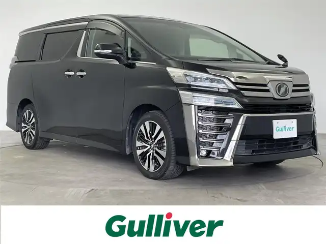 トヨタ ヴェルファイア Z Gエディション 大分県 2018(平30)年 4.5万km ブラック 登録時走行距離44429km/ツインムーンルーフ/黒本革シート/純正12.1インチフリップダウンモニター/純正10インチナビ/フルセグTV(AM/FM/CD/DVD/Bluetooth)/バックカメラ/両側パワースライドドア/ビルトインETC/D/N席シートヒーター/D/N席ベンチレーション/ステアリングヒーター/トヨタセーフティセンス/・プリクラッシュセーフティ/・レーダークルーズコントロール/・オートマチックハイビーム/・レーンディパーチャーアラート/オートブレーキホールド/オットマン/18インチ純正AW/純正フロアマット