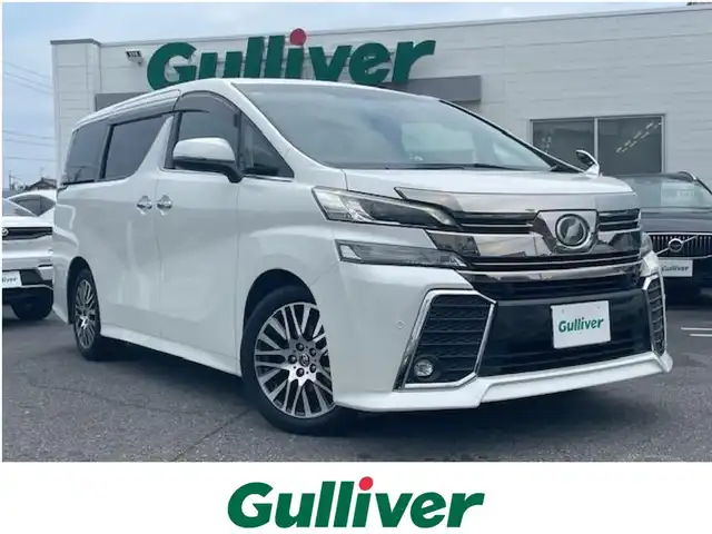 トヨタ ヴェルファイア Z Gエディション 三重県 2016(平28)年 6.7万km ホワイトパールクリスタルシャイン メーカーオプション/・レーダークルーズコントロール/・インテリジェントクリアランスソナー/・プリクラッシュセーフティシステム/1オーナー/純正11型フリップダウンモニター/純正10型SDナビ/フルセグTV/【CD/DVD/SD/Bluetooth】/バックカメラ/ビルトインETC/両側パワースライドドア/ハーフレザーシート/D/N席パワーシート/2列目エグゼクティブパワーシート/パワーバックドア/サンシェード/ステアリングヒーター/オートライト/LEDヘッドランプ/LEDフロントフォグランプ/235/50R18インチ純正AW/プッシュスタート/スマートキー/スペアキー/純正フロアマット