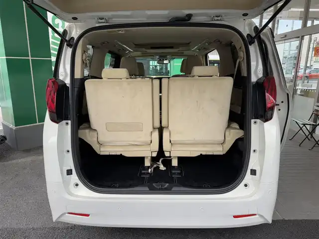 トヨタ アルファードハイブリット G 広島県 2015(平27)年 7.8万km ラグジュアリーホワイトパールクリスタルシャインガラスフレーク ワンオーナー/純正メーカーオプション9.2インチSDナビ/・JBLサウンドシステム/・フルセグTV/・Bluetooth/パノラミックビューモニター/レーダークルーズコントロール/インテリジェントクリアランスソナー/プリクラッシュセーフティシステム/モデリスタエアロ/ツインムーンルーフ/両側パワースライドドア/パワーシート（D/N）/N席パワーオットマン/スマートキープッシュスタート