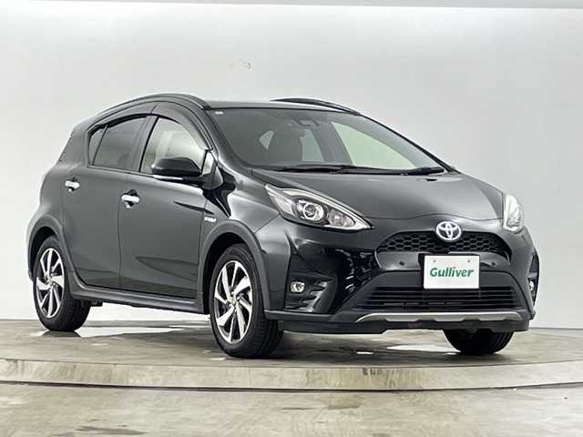 トヨタ アクア クロスオーバー グラム 愛知県 2019(令1)年 2.6万km ブラックマイカ 純正７インチSDナビ/（Bluetooth/ワンセグTV)/バックカメラ/ビルトインETC/トヨタセーフティセンス/前後クリアランスソナー/ドライブレコーダー前（DRT-H68A）/ハーフレザーシート/ステアリングスイッチ/ビルドインETC/LEDヘットライト/LEDフォグライト/純正16インチアルミホイール/プッシュエンジンスタート/スマートキー/保証書・取扱説明書