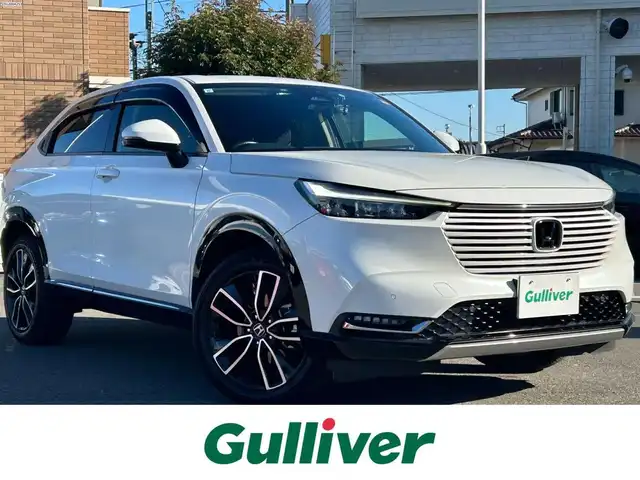 ホンダ ヴェゼル ハイブリッド e:HEV Z 群馬県 2021(令3)年 5.9万km プラチナホワイトパール ワンオーナー/ホンダセンシング/衝突軽減ブレーキ/純正メモリーナビ/バックカメラ　Bluetooth フルセグＴＶ/アダプティブクルーズコントロール/ヒルディセントコントロールスイッチ/両前席シートヒーター/パワーバックドア/パドルシフト/ステアリングヒーター/ステアリングリモコン/ビルトインＥＴＣ２．０/ブラインドスポットインフォメーション/ワイヤレススマホ充電/チップアップシート/社外ドライブレコーダー（前後カメラ）/保証書/取説/スペアキーｘ１