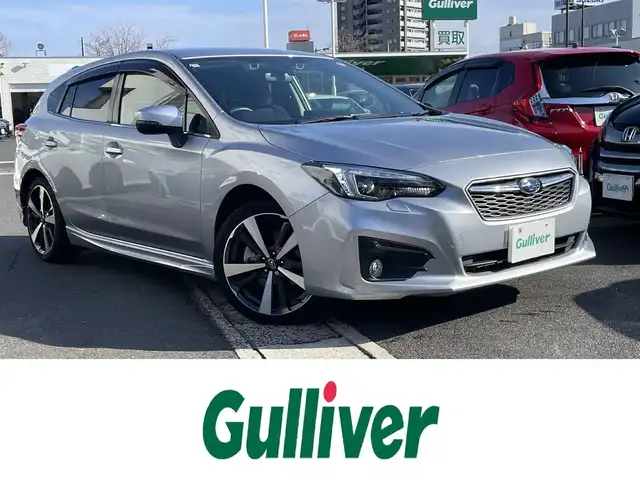 スバル インプレッサ スポーツ 2．0i－S アイサイト 島根県 2016(平28)年 0.9万km アイスシルバーメタリック 純正メモリナビ/フルセグＴＶ/Ｂｌｕｅｔｏｏｔｈ・ＵＳＢ接続/CD・DVD再生/ＥＴＣ2.0/バックカメラ/前方ドライブレコーダー/アイサイト/衝突軽減ブレーキ/レーンキープアシスト/誤発進抑制機能/ブラインドスポットモニター/追従式クルーズコントロール/前席パワーシート/電動パーキングブレーキ/オートブレーキホールド/純正フロアマット/横滑り防止装置/純正18インチアルミホイール/LEDオートライト/フォグランプ/トノカバー/電動格納ウインカーミラー/ドアバイザー/スマートキー/プッシュスタート