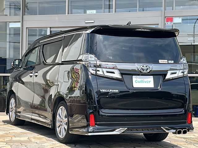 トヨタ ヴェルファイア Z ゴールデンアイズ 静岡県 2021(令3)年 2万km ブラック 純正ナビ/・AM/FM/・CD/DVD/・USB/・Bluetooth/・Miracast/セーフティセンス/プリクラッシュセーフティ/（ミリ波レーダー・単眼カメラ・昼自転車運転者＆夜間歩行者検知機能付）/（対車両：自車車速域約10km/hから最高速度：最大約40km/h減速可）/（対歩行者：自車車速域約10km/hから80km/h間：最大約30km/h減速可）/レーダークルーズコントロール（全車速追従機能付/ブレーキ制御付）/レーントレーシングアシスト（LTA）（作動車速：50km/h以上時）（ステアリング操作支援）/ロードサインアシスト（RSA）（道路標識認識支援）/オートマチックハイビーム/主要装備/・前後ドラレコ/・デジタルインナーミラー/・後席フリップダウンモニター/・ＥＴＣ/・オートハイビーム/・クリアランスソナー/・ＭＴモード付ＡＴ/・ＡＣ１００Ｖ電源/・モデリスタエアロ/・両側パワスラ/・電動パーキング/・ブラインドスポットモニター/・クリアランスソナー