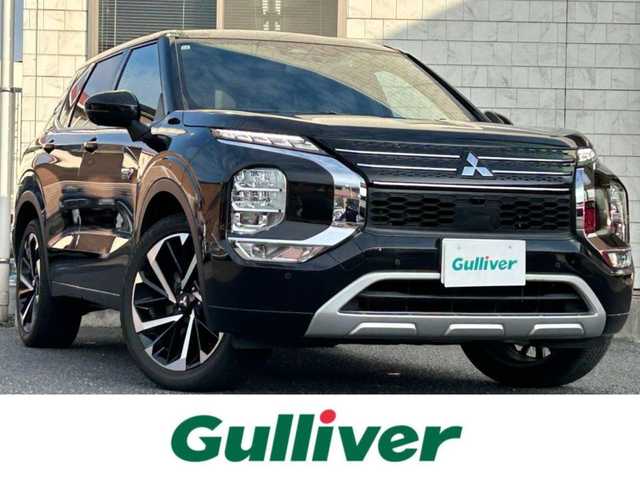 三菱 アウトランダー ＰＨＥＶ P 福岡県 2021(令3)年 3万km ブラックダイヤモンド 純正9インチディスプレイオーディオ/　（AM/FM/Bluetooth/フルセグTV/ナビキット）/BOSEプレミアムサウンド/フロント/サイド/バックカメラ/マルチアラウンドモニター/黒色レザーシートリフレッシュ機能付/e-Assist/・マイパイロット/・衝突被害軽減ブレーキシステム/・前方衝突予測警報/・踏み間違え衝突防止アシスト/・車線逸脱警報システム/・後側方車両検知警報システム/・後側方衝突防止支援システム/・後退時車両検知警報システム/・ふらつき警報/・標識認識システム/・アダプティブLEDヘッドライト/レーダークルーズコントロール/オートライト/コナーセンサー/クリアランスソナー/ヒルディセントコントロール/純正20インチアルミホイール/パワーバックドア/ヘッドアップディスプレイ/パワーシート（D/N）/シートヒーター（全席）/ポジションメモリ（D/N）/ステアリングヒーター/パドルシフト/置くだけ充電/サンシェード/前後ドライブレコーダー（HDR963GW）/ビルトインETC2.0/充電ケーブル/100VAC電源/ISOFIX/スペアキー×1/保証書/取扱説明書/ナビ取扱説明書