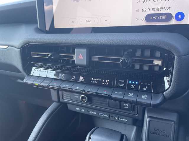 トヨタ ランドクルーザー ２５０ VX ファーストエディション 愛知県 2024(令6)年 0.5万km ベージュ トヨタチームメイト/モデリスタエアロ/純正12.3型ディズプレイオーディオ　ナビ機能なし/全方位カメラ/サンルーフ/レーダークルーズコントロール/シートヒーター/エアシート/電動リアゲート/パワーシート/コーナーセンサー/純正アルミホイール/ルーフレール/ETC2.0/ブラインドスポットモニター/４WD/LEDヘッドライト/インテリジェントミラー/ステアリングヒーター/リアオートエアコン/Bluetooth/衝突軽減システム/ステアリングスイッチ/スマートキー/プッシュスタート