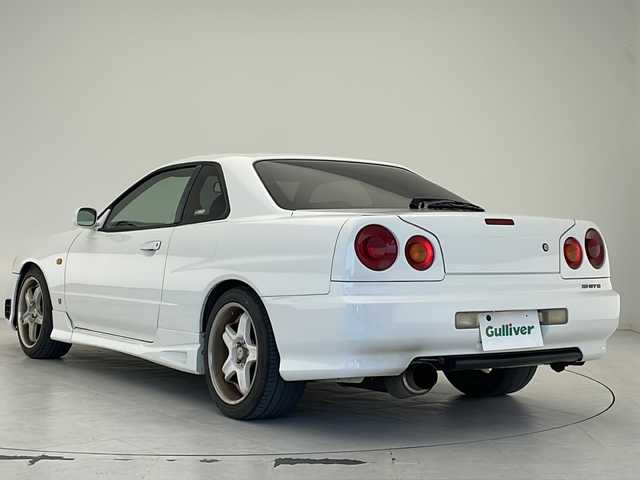 日産 スカイライン 25GT ターボ 沖縄県 1998(平10)年 14.5万km 白 5速MT/純正オーディオ(DH-700)/CD/ヘッドライトレベライザー /パワーステアリング/パワーウィンドウ/電格ミラー/リモコンキー/社外アルミ(RS-5)/柿本 Regu 92-Z マフラー