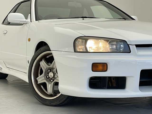 日産 スカイライン 25GT ターボ 沖縄県 1998(平10)年 14.5万km 白 5速MT/純正オーディオ(DH-700)/CD/ヘッドライトレベライザー /パワーステアリング/パワーウィンドウ/電格ミラー/リモコンキー/社外アルミ(RS-5)/柿本 Regu 92-Z マフラー