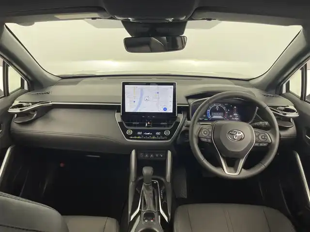 トヨタ カローラ クロス ハイブリッド Z 大分県 2024(令6)年 0.1万km プラチナホワイトパールマイカ トヨタセーフティセンス/・プリクラッシュセーフティ/・レーントレーシングアシスト/・オートマチックハイビーム/・レーダークルーズコントロール/純正ディスプレイオーディオ/（BT/フルセグTV/AppleCarPlay/パノラミックビューモニター/パノラマルーフ/パワーバックドア/LEDオートライト/フォグランプ/ハーフレザーシート/パワーシート/シートヒーター/純正18インチアルミホイール/クリアランスソナー/スマートキー/ETC2.0/保証書