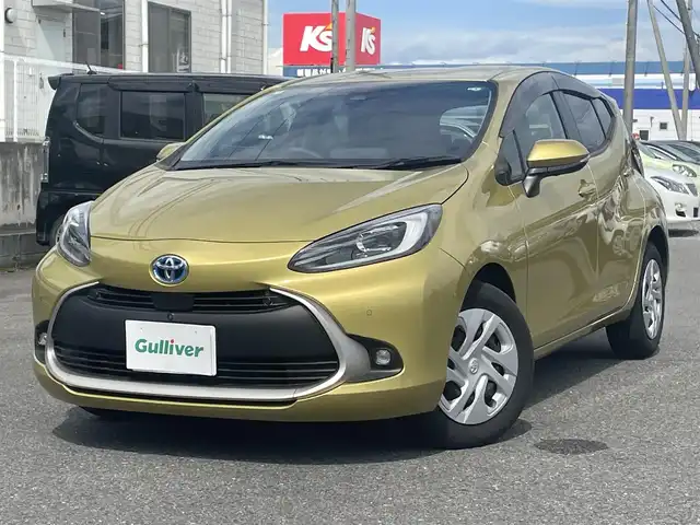 トヨタ アクア G 群馬県 2024(令6)年 0.4万km ブラスゴールドメタリック ワンオーナー/純正メモリナビ（BT.CD)/アラウンドビューモニター/プリクラッシュ/レーンキープアシスト/レーダークルーズコントロール/BSM/革巻きステア/ドアバイザー/オートマチックハイビーム/ヘッドライトレベライザー/スマートキー×２/LEDライト/ウィンカーミラー/CD、DVDプレーヤー/保証書、取説