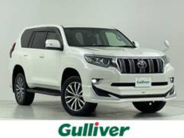 トヨタ ランドクルーザー プラド TX Lパッケージ 大阪府 2019(平31)年 4.4万km ホワイトパールクリスタルシャイン トヨタセーフティーセンス/　・プリクラッシュセーフティー/　・車線逸脱警報/　・レーダークルーズコントロール/　・オートマチックハイビーム/社外ディスプレイオーディオ/　CD/DVD/BT/バックカメラ/モデリスタエアロ/　フロント/リア/LEDヘッドライト/レザーシート/パワーシート/シートヒーター/エアシート/純正19インチアルミホイール/スマートキー/プッシュスタート/フォグランプ