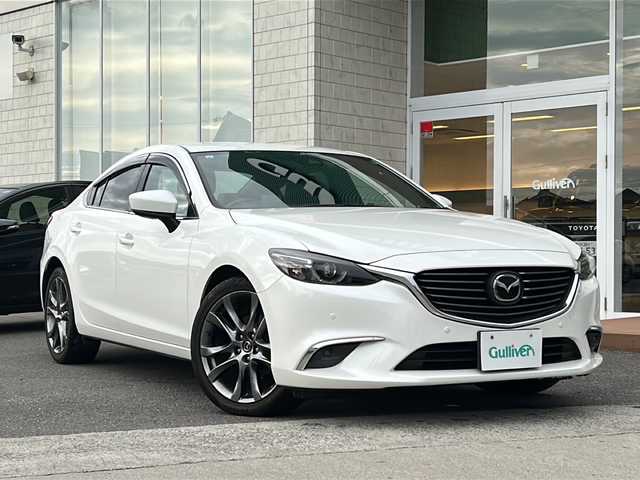 マツダ アテンザ セダン 25S Lパッケージ 香川県 2017(平29)年 7.4万km スノーフレイクホワイトパールマイカ 純正ナビ/　(Bluetooth/CD/DVD)/フルセグTV/BOSEサウンドシステム/バックカメラ/ドライブレコーダー/レーダークルーズコントロール/パーキングセンサー/i-ACTIVSENSE/・アドバンスドスマートシティブレーキサポート/・後退時スマートシティブレーキサポート/・AT誤発進抑制制御機能/・スマートブレーキサポート/・レーンキープアシストシステム/・車線逸脱警報システム/・ブラインドスポットモニタリング/・ドライバーアテンションアラート/・交通標識認識システム/アクティブドライビングディスプレイ/LEDヘッドランプ/本革巻きステアリング/パドルシフト/パーフォレーション革シート/全席シートヒーター/前席パワーシート/純正19インチアルミホイール/アドバンストキーレスエントリーシステム/禁煙車