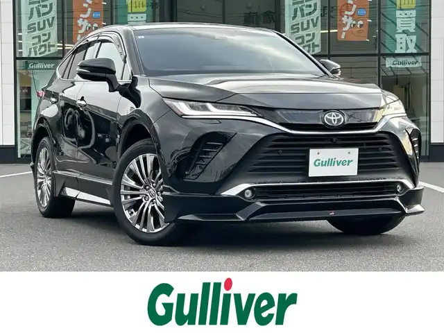 トヨタ ハリアー ハイブリッド Z レザーパッケージ 岡山県 2021(令3)年 9.7万km プレシャスブラックパール 登録時走行距離69650km/GRエアロ/JBLプレミアムサウンド/純正12.3インチナビ/フルセグTV(AM/FM/Bluetooth)/全方位カメラ/ビルトインETC2.0/デジタルインナーミラー/ヘッドアップディスプレイ/トヨタセーフティセンス/・ブラインドスポットモニター/・プリクラッシュセーフティ/・レーダークルーズコントロール/・レーンディバーチャーアラート/D/N席シートヒーター/D/N席ベンチレーション/ステアリングヒーター/クリアランスソナー/横滑り防止装置/アイドリングストップ/パワーバックドア/19インチ純正AW/フロアマット/本革シート/D+N席パワーシート/社外マフラー