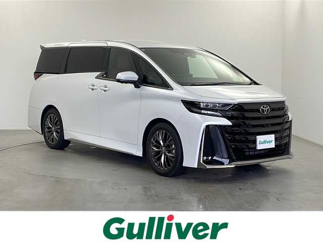トヨタ ヴェルファイア Z プレミア 栃木県 2024(令6)年 0.8万km プラチナホワイトパールマイカ 純正ナビ　14インチ/(BT/AM/FM/フルセグ）/ビルトインETC/前後ドライブレコーダー/フリップダウンモニター/インテリジェントルームミラー/レーダークルーズコントロール/横滑り防止/プリクラッシュブレーキ/ブラインドスポットモニター/パーキングサポート/ステアリングヒーター/両側パワースライドドア/電動リアゲート/サンルーフ/置くだけ充電/シートヒーター/エアシート/オットマン/パワーシート/プッシュスタート/スマートキー