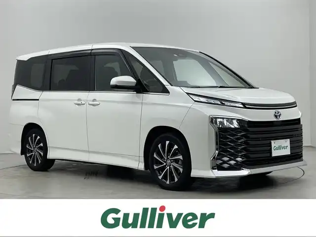 トヨタ ヴォクシー ハイブリッド S－Z 埼玉県 2022(令4)年 1.9万km ホワイトパールクリスタルシャイン 純正８インチディスプレイオーディオ　フリップダウンモニター　バックカメラ　快適利便パッケージ　デジタルミラー　両側パワースライドドア　シートヒーター　ＡＣ１００Ｖ　ビルトインＥＴＣ２．０　ＬＥＤライト