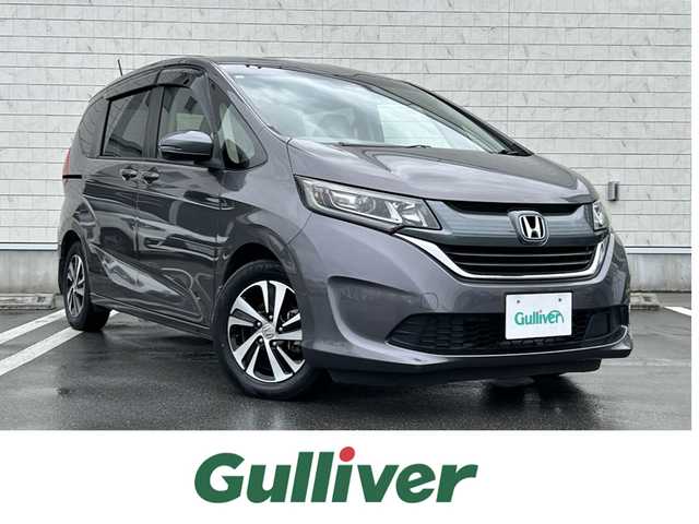 ホンダ フリード G ホンダセンシング 静岡県 2016(平28)年 6.1万km モダンスティールM HondaSENSING/純正9インチプレミアムインターナビ/ （VXM-175VFNi）/   AM FM CD DVD Bluetooth SD MusicRack/フルセグTV/バックモニター/ビルトインETC/両側パワースライドドア/アダプティブクルーズコントロール/アイドリングストップ/ステアリングスイッチ/ウォークスルー/純正15インチアルミホイール/本革巻ステアリング/電動格納ミラー/ドアバイザー/スマートキー＆プッシュスタート