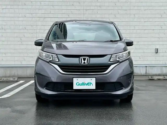 ホンダ フリード G ホンダセンシング 静岡県 2016(平28)年 6.1万km モダンスティールM HondaSENSING/純正9インチプレミアムインターナビ/ （VXM-175VFNi）/   AM FM CD DVD Bluetooth SD MusicRack/フルセグTV/バックモニター/ビルトインETC/両側パワースライドドア/アダプティブクルーズコントロール/アイドリングストップ/ステアリングスイッチ/ウォークスルー/純正15インチアルミホイール/本革巻ステアリング/電動格納ミラー/ドアバイザー/スマートキー＆プッシュスタート