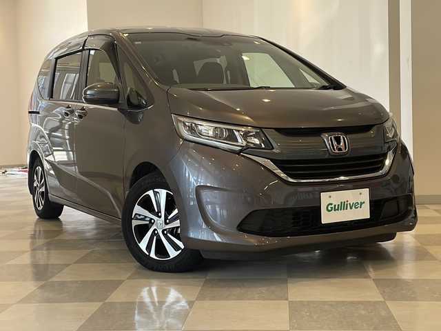ホンダ フリード G ホンダセンシング 福井県 2016(平28)年 6.1万km モダンスティールM HondaSENSING/純正9インチプレミアムインターナビ/ （VXM-175VFNi）/   AM FM CD DVD Bluetooth SD MusicRack/フルセグTV/バックモニター/ビルトインETC/両側パワースライドドア/アダプティブクルーズコントロール/アイドリングストップ/ステアリングスイッチ/ウォークスルー/純正15インチアルミホイール/本革巻ステアリング/電動格納ミラー/ドアバイザー/スマートキー＆プッシュスタート