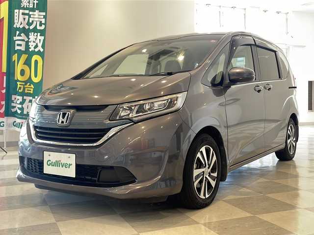 ホンダ フリード G ホンダセンシング 福井県 2016(平28)年 6.1万km モダンスティールM HondaSENSING/純正9インチプレミアムインターナビ/ （VXM-175VFNi）/   AM FM CD DVD Bluetooth SD MusicRack/フルセグTV/バックモニター/ビルトインETC/両側パワースライドドア/アダプティブクルーズコントロール/アイドリングストップ/ステアリングスイッチ/ウォークスルー/純正15インチアルミホイール/本革巻ステアリング/電動格納ミラー/ドアバイザー/スマートキー＆プッシュスタート