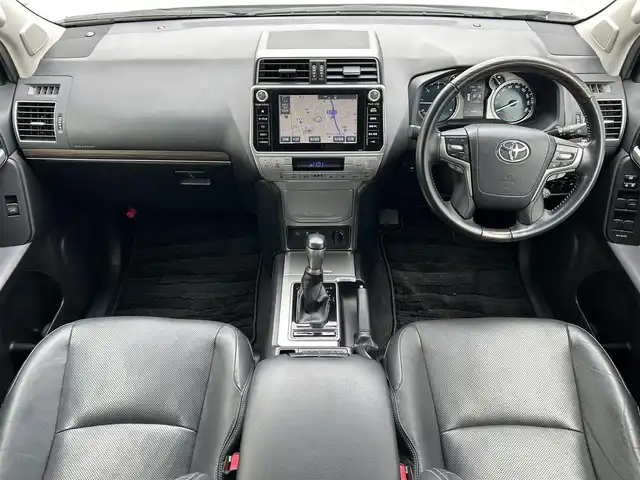 トヨタ ランドクルーザー プラド TX Lパッケージ 滋賀県 2018(平30)年 5万km ホワイトパールクリスタルシャイン ディーゼル/4WD(F4)/6速AT/純正ナビ【B9129】/（フルセグ/AM/FM/CD/DVD/Bluetooth/USB/SD）/プリクラッシュブレーキアシスト	/ブレーキアシスト	/ヒルスタート（坂道発進）アシスト	/ブラインドスポットモニター/レーンキープアシスト	/バックカメラ前/後/360°カメラ（フロント/サイド/バック）/ETC/レーダークルーズ/オートハイビーム/フロント・リアエアロ/ヘッドライトウォッシャー/前後コーナーセンサー/センターデフフロック/シートヒーターD/N席/ベンチレーションD/N席/MTモード付AT/D/N席パワーシート/電動格納サードシート/19インチ純正AW/ウッドコンビステアリング/テレビキャンセラー/横滑り防止/純正エンジンスターター/USBポート/純正マット/プッシュスタート/ウィンカーミラー/電動格納ミラー