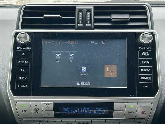 トヨタ ランドクルーザー プラド TX Lパッケージ 滋賀県 2018(平30)年 5万km ホワイトパールクリスタルシャイン ディーゼル/4WD(F4)/6速AT/純正ナビ【B9129】/（フルセグ/AM/FM/CD/DVD/Bluetooth/USB/SD）/プリクラッシュブレーキアシスト	/ブレーキアシスト	/ヒルスタート（坂道発進）アシスト	/ブラインドスポットモニター/レーンキープアシスト	/バックカメラ前/後/360°カメラ（フロント/サイド/バック）/ETC/レーダークルーズ/オートハイビーム/フロント・リアエアロ/ヘッドライトウォッシャー/前後コーナーセンサー/センターデフフロック/シートヒーターD/N席/ベンチレーションD/N席/MTモード付AT/D/N席パワーシート/電動格納サードシート/19インチ純正AW/ウッドコンビステアリング/テレビキャンセラー/横滑り防止/純正エンジンスターター/USBポート/純正マット/プッシュスタート/ウィンカーミラー/電動格納ミラー
