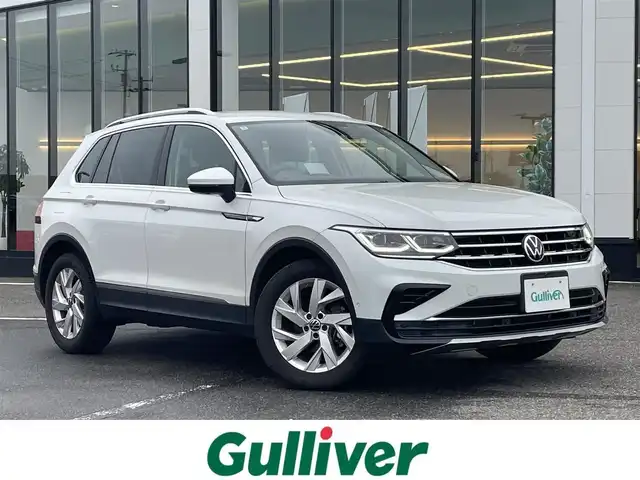フォルクスワーゲン ＶＷ ティグアン TSI エレガンス 新潟県 2021(令3)年 3万km オリックスホワイトパールエフェクト 純正ナビ/(Bluetooth/AppleCarPlay/AndroidAuto)/フルセグTV/衝突軽減ブレーキ/レーンキープアシスト/レーダークルーズコントロール/全方位カメラ/バックカメラ/全席シートヒーター/電動リアゲート/パーキングアシスト/ヘッドアップディスプレイ/ドライブレコーダー（前後）/ビルトインETC/プッシュスタート/スマートキー/スペアキー×1/保証書