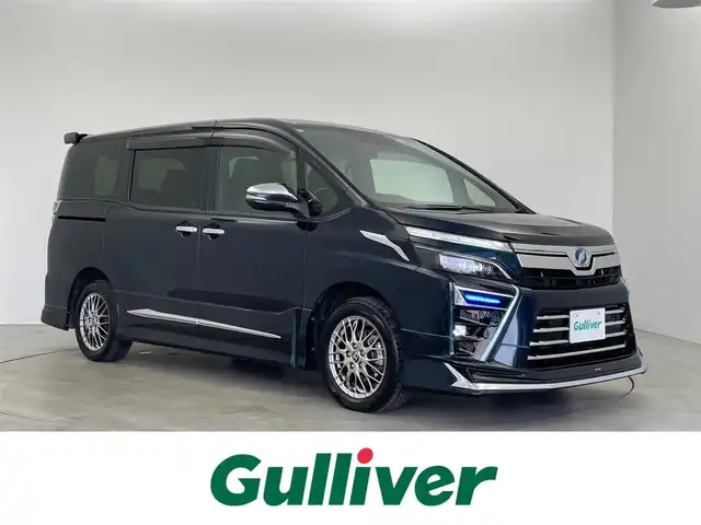 トヨタ ヴォクシー ハイブリッド ZS 煌Ⅱ 埼玉県 2019(平31)年 6.3万km ブラッキッシュアゲハガラスフレーク モデリスタフルエアロ/モデリスタマフラー/モデリスタヘッドライトガーニッシュ/モデリスタシグネチャーイルミブレード/モデリスタドアハンドルガーニッシュ/純正10インチSDナビ/(CD/DVD/Bluetooth/USB/HDMI/音楽録音/フルセグ)/フリップダウンモニター/両側パワースライドドア/バックカメラ/ドライブレコーダー/プリクラッシュセーフティ/クルーズコントロール/ビルトインETC2.0/シートヒーター/オートLEDライト/純正16インチアルミホイール