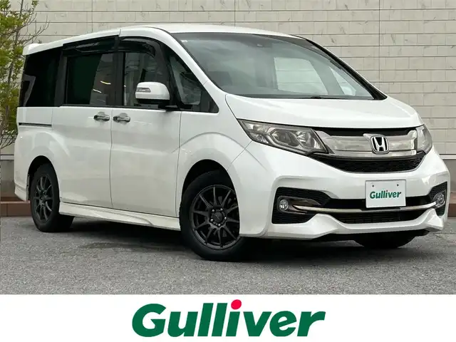 ホンダ ステップワゴン スパーダ クールスピリット 滋賀県 2016(平28)年 7.8万km ホワイトオーキッドパール ガソリン/2WD(FF)/CVT/純正SDナビ/（フルセグ/Bluetooth/CD/DVD/ipod/AM/FM/SD）/プリクラッシュブレーキアシスト/ヒルスタート（坂道発進）アシスト/レーンキープアシスト/バックカメラ/ETC/フリップダウンモニター/横滑り防止/ECON/アイドリングストップ/パドルシフト/シートヒーター/両側パワースライドドア/ミラーヒーター/レーダクルーズコントロール/ドライブレコーダー/オートライト/フォグランプ/純正マット/ドアバイザー/純正AW付きサマー積込み/（205/55/R17）/ウィンカーミラー/集中ドアロック
