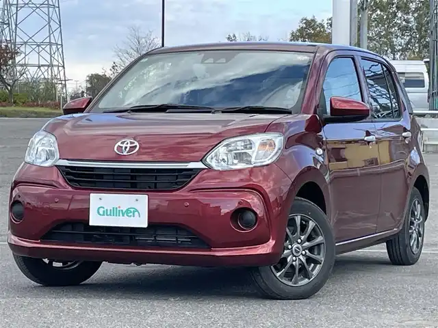 トヨタ パッソ X Lパッケージ 道央・札幌 2022(令4)年 1.1万km ファイアークォーツレッドM ４WD/ワンオーナー/寒冷地仕様/社外オーディオ/AM/FM/CD/AUX/衝突被害軽減ブレーキ/横滑り防止装置/レーンキープアシスト/クリアランスソナー/ビルトインETC/アイドリングストップ/ワイパーデアイサー/D席メモリーシート/プッシュスタート/スマートキー/LEDヘッドライト/オートライト/オートハイビーム/電動格納ミラー/純正フロアマット/スペアキー/スチールホイール付冬タイヤ積込/（純正ホイールキャップ有）/165/65/R14/2021年/山7mm