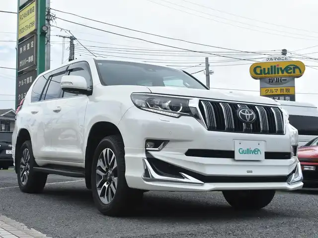トヨタ ランドクルーザー プラド TX Lパッケージ 神奈川県 2023(令5)年 1万km ホワイトパールクリスタルシャイン ワンオーナー/モデリスタエアロ/純正メモリナビ/フルセグテレビ/全方位カメラ/サンルーフ/レザーシート/エアーシート/シートヒーター/クルーズコントロール/ETC2.0/LEDヘッドライト/保証書/取説/ナビ説/記録(R.6)/スペアスマートキー