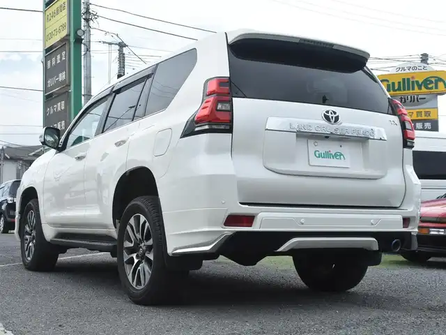トヨタ ランドクルーザー プラド TX Lパッケージ 神奈川県 2023(令5)年 1万km ホワイトパールクリスタルシャイン ワンオーナー/モデリスタエアロ/純正メモリナビ/フルセグテレビ/全方位カメラ/サンルーフ/レザーシート/エアーシート/シートヒーター/クルーズコントロール/ETC2.0/LEDヘッドライト/保証書/取説/ナビ説/記録(R.6)/スペアスマートキー