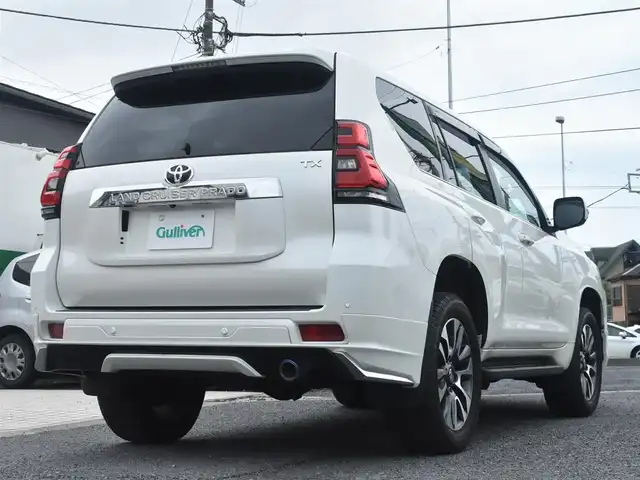 トヨタ ランドクルーザー プラド TX Lパッケージ 神奈川県 2023(令5)年 1万km ホワイトパールクリスタルシャイン ワンオーナー/モデリスタエアロ/純正メモリナビ/フルセグテレビ/全方位カメラ/サンルーフ/レザーシート/エアーシート/シートヒーター/クルーズコントロール/ETC2.0/LEDヘッドライト/保証書/取説/ナビ説/記録(R.6)/スペアスマートキー