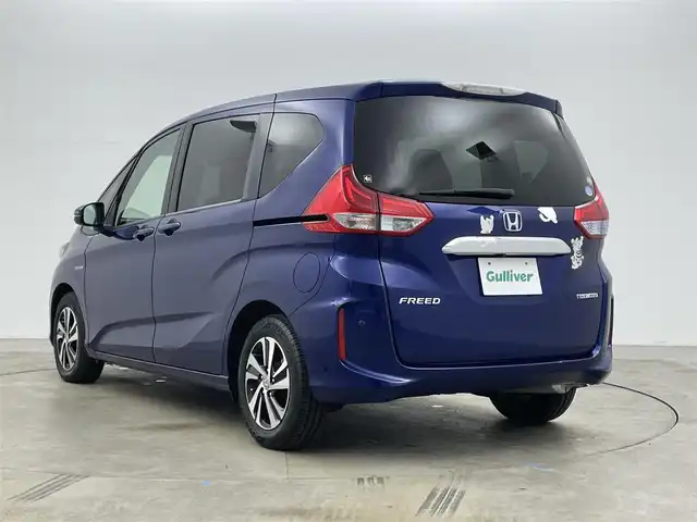 ホンダ フリード ハイブリット EX 岡山県 2016(平28)年 5.7万km コバルトブルーパール 純正9インチナビ【VXM-175VFNi】/(AM/FM/DVD/CD/BT/フルセグ)/社外フリップダウンモニター【TVM-FW1030】/両側パワースライドドア/衝突軽減ブレーキ/バックカメラ/アダプティブクルーズコントロール/社外360度ドライブレコーダー/ハーフレザー/前席シートヒーター/後席サンシェイド/純正アルミホイール/ＬＥＤヘッドライト/オートライト