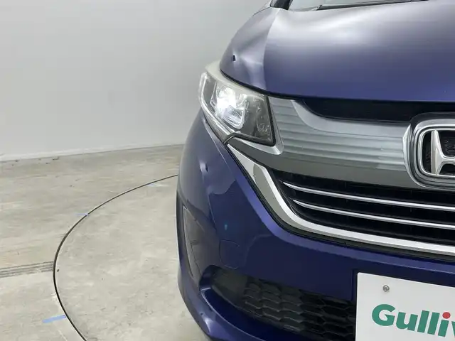 ホンダ フリード ハイブリット EX 岡山県 2016(平28)年 5.7万km コバルトブルーパール 純正9インチナビ【VXM-175VFNi】/(AM/FM/DVD/CD/BT/フルセグ)/社外フリップダウンモニター【TVM-FW1030】/両側パワースライドドア/衝突軽減ブレーキ/バックカメラ/アダプティブクルーズコントロール/社外360度ドライブレコーダー/ハーフレザー/前席シートヒーター/後席サンシェイド/純正アルミホイール/ＬＥＤヘッドライト/オートライト