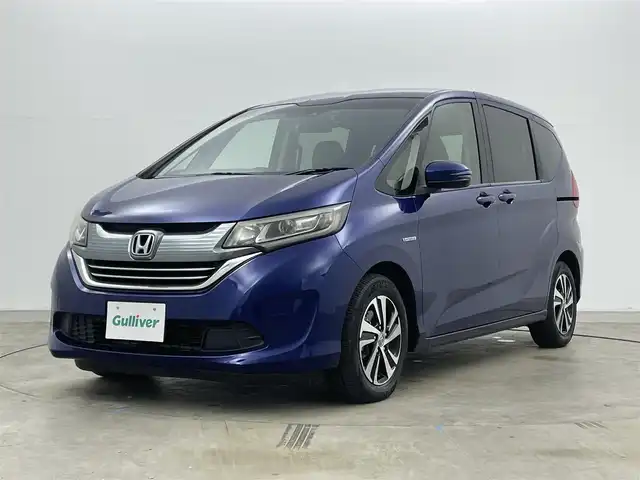 ホンダ フリード ハイブリット EX 岡山県 2016(平28)年 5.7万km コバルトブルーパール 純正9インチナビ【VXM-175VFNi】/(AM/FM/DVD/CD/BT/フルセグ)/社外フリップダウンモニター【TVM-FW1030】/両側パワースライドドア/衝突軽減ブレーキ/バックカメラ/アダプティブクルーズコントロール/社外360度ドライブレコーダー/ハーフレザー/前席シートヒーター/後席サンシェイド/純正アルミホイール/ＬＥＤヘッドライト/オートライト