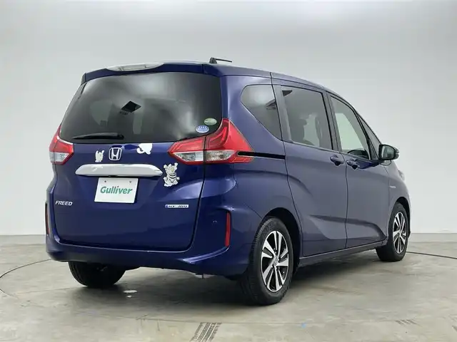 ホンダ フリード ハイブリット EX 岡山県 2016(平28)年 5.7万km コバルトブルーパール 純正9インチナビ【VXM-175VFNi】/(AM/FM/DVD/CD/BT/フルセグ)/社外フリップダウンモニター【TVM-FW1030】/両側パワースライドドア/衝突軽減ブレーキ/バックカメラ/アダプティブクルーズコントロール/社外360度ドライブレコーダー/ハーフレザー/前席シートヒーター/後席サンシェイド/純正アルミホイール/ＬＥＤヘッドライト/オートライト