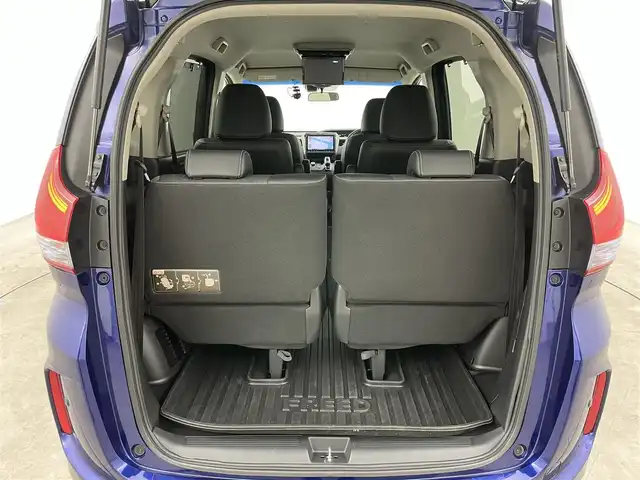 ホンダ フリード ハイブリット EX 岡山県 2016(平28)年 5.7万km コバルトブルーパール 純正9インチナビ【VXM-175VFNi】/(AM/FM/DVD/CD/BT/フルセグ)/社外フリップダウンモニター【TVM-FW1030】/両側パワースライドドア/衝突軽減ブレーキ/バックカメラ/アダプティブクルーズコントロール/社外360度ドライブレコーダー/ハーフレザー/前席シートヒーター/後席サンシェイド/純正アルミホイール/ＬＥＤヘッドライト/オートライト