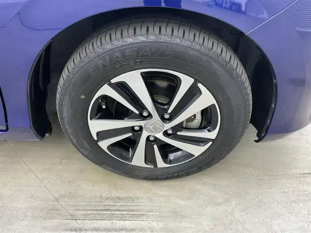 ホンダ フリード ハイブリット EX 岡山県 2016(平28)年 5.7万km コバルトブルーパール 純正9インチナビ【VXM-175VFNi】/(AM/FM/DVD/CD/BT/フルセグ)/社外フリップダウンモニター【TVM-FW1030】/両側パワースライドドア/衝突軽減ブレーキ/バックカメラ/アダプティブクルーズコントロール/社外360度ドライブレコーダー/ハーフレザー/前席シートヒーター/後席サンシェイド/純正アルミホイール/ＬＥＤヘッドライト/オートライト