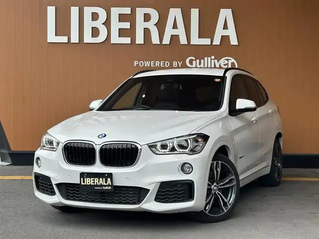 ＢＭＷ Ｘ１ xDrive 18d Mスポーツ 高知県 2018(平30)年 4.6万km アルピンホワイトⅢ 登録時走行距離　45611km/純正HDDナビ/バックカメラ/アドバンスドアクティブセーフティパッケージ/　アクティブクルーズコントロール/　ヘッドアップディスプレイ/ハイラインパッケージ/　パーフォレーション/　パワーシート/　シートヒーター/コンフォートパッケージ/　パワーバックドア/　リアシートスライディング/バックレストリリース機能/インテリジェントセーフティ/クリアランスソナー/ETC/オートワイパー/オートライト/純正LEDライト/フォグランプ/スマートキー/プッシュスタート/純正オプションアルミホイール 19インチ/ドアバイザー/ウインカーミラー/純正フロアマット/新車時整備手帳（保証書）/取扱説明書