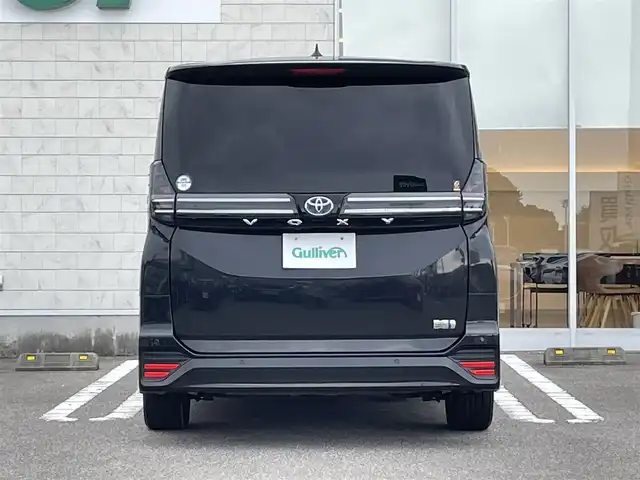 トヨタ ヴォクシー ハイブリッド S－Z 宮崎県 2022(令4)年 5.4万km グリッターブラックガラスフレーク 純正10.5インチナビ/（CD/DVD/AM/FM/BT/USB)/フルセグTV/TVキャンセラー/バックカメラ/両側パワースライドドア/ステアリングスイッチ/レーダークルーズコントロール/D席/N席シートヒーター/D席/N席シートクーラー/ハーフレザーシート/純正フリップダウンモニタ/前後ドライブレコーダー/ユニバーサルステップ/AC100電源/3眼LEDヘッドライト/ビルトインETC