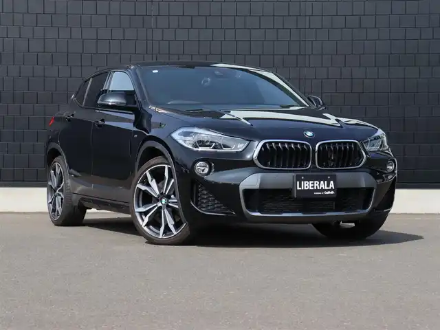ＢＭＷ Ｘ２ xDrive20i MスポーツX 宮城県 2019(平31)年 4万km サファイアブラックP 純正ナビ（ＢＴ）/ACC/インテリジェントセーフティ/ダイナミックトラクションコントロール/パークディスタンス/ダウンヒルアシスト/バックカメラ/ドライブモード/ブラウンレザーシート/パワーシート（DN席）/コーナーセンサー（前後）/デュアルエアコン/電動格納ミラー/ドライブレコーダー（前方）/リヤフォグランプ/フロントフォグランプ/プッシュスタート/コンフォートアクセス/MTモード付/ミラー一体型ETC/純正20インチAW/純正フロアマット/ＬＥＤヘッドライト/オートライト/アイドリングストップ/禁煙車