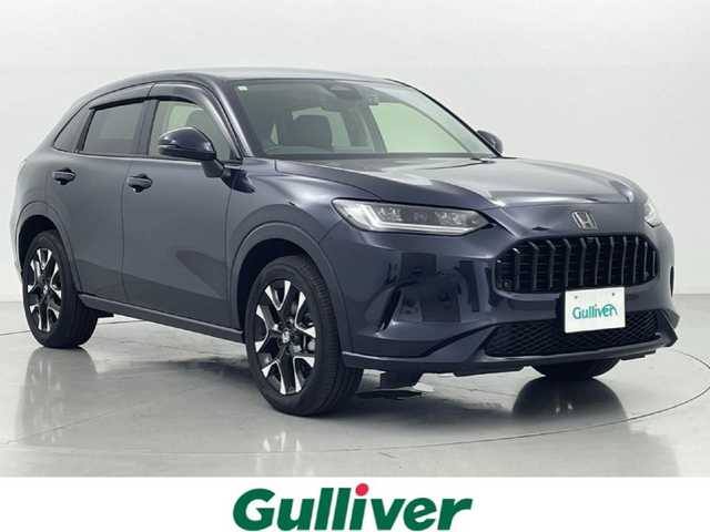 ホンダ ＺＲ－Ｖ ハイブリッド e:HEV Z 熊本県 2023(令5)年 0.9万km ミッドナイトブルービームM ワンオーナー　/ＢＯＳＥサウンド　/社外前後ドライブレコーダー　/全周囲カメラ　/純正ナビ　/ビルトインＥＴＣ２．０　/ホンダセンシング/・レーダークルーズコントロール/・衝突軽減ブレーキ/・路外逸脱制御機能/・車線維持支援システム/・トラフィックジャムアシスト/・先行車発進お知らせ機能/・標識認識機能/・パーキングセンサー/横滑り防止/前後クリアランスソナー　/前席シートヒーター　/前席パワーシート/置くだけ充電/パワーバックドア/パドルシフト/オートブレーキホールド/純正フロアマット/純正１８インチAW/シーケンシャルウインカー/オートライト/LEDヘッドライト/スマートキー/プッシュスタート/スペアキー1本/保証書/取扱説明書