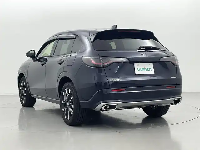 ホンダ ＺＲ－Ｖ ハイブリッド e:HEV Z 熊本県 2023(令5)年 0.9万km ミッドナイトブルービームM ワンオーナー　/ＢＯＳＥサウンド　/社外前後ドライブレコーダー　/全周囲カメラ　/純正ナビ　/ビルトインＥＴＣ２．０　/ホンダセンシング/・レーダークルーズコントロール/・衝突軽減ブレーキ/・路外逸脱制御機能/・車線維持支援システム/・トラフィックジャムアシスト/・先行車発進お知らせ機能/・標識認識機能/・パーキングセンサー/横滑り防止/前後クリアランスソナー　/前席シートヒーター　/前席パワーシート/置くだけ充電/パワーバックドア/パドルシフト/オートブレーキホールド/純正フロアマット/純正１８インチAW/シーケンシャルウインカー/オートライト/LEDヘッドライト/スマートキー/プッシュスタート/スペアキー1本/保証書/取扱説明書