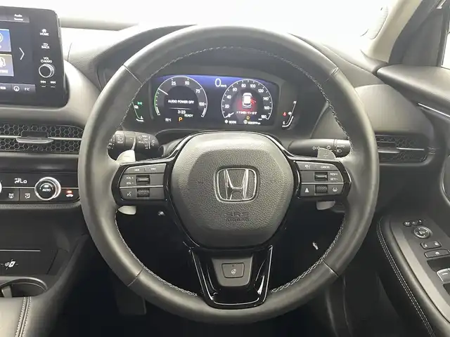 ホンダ ＺＲ－Ｖ ハイブリッド e:HEV Z 熊本県 2023(令5)年 0.9万km ミッドナイトブルービームM ワンオーナー　/ＢＯＳＥサウンド　/社外前後ドライブレコーダー　/全周囲カメラ　/純正ナビ　/ビルトインＥＴＣ２．０　/ホンダセンシング/・レーダークルーズコントロール/・衝突軽減ブレーキ/・路外逸脱制御機能/・車線維持支援システム/・トラフィックジャムアシスト/・先行車発進お知らせ機能/・標識認識機能/・パーキングセンサー/横滑り防止/前後クリアランスソナー　/前席シートヒーター　/前席パワーシート/置くだけ充電/パワーバックドア/パドルシフト/オートブレーキホールド/純正フロアマット/純正１８インチAW/シーケンシャルウインカー/オートライト/LEDヘッドライト/スマートキー/プッシュスタート/スペアキー1本/保証書/取扱説明書