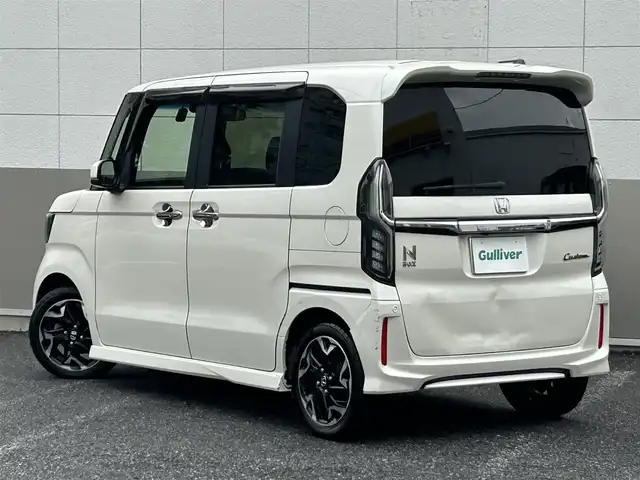 ホンダ Ｎ ＢＯＸ カスタム G L ターボ ホンダセンシング 東京都 2018(平30)年 6.5万km プレミアムホワイトパールⅡ ワンオーナー/純正SDナビ/　フルセグTV/CD/DVD/Bluetooth/USB/SD/バックカメラ/純正ドライブレコーダー/ホンダセンシング/・衝突軽減ブレーキ/・誤発信抑制機能/・アダプティブクルーズコントロール/・車線逸脱警報/・トラフィックジャムアシスト/横滑り防止装置/カーテンエアバック/ビルトインETC/純正15インチアルミホイール/純正フロアマット/社外フロントグリル/両側パワースライドドア/アイドリングストップ/ウインカーミラー/ドアバイザー/チップアップシート/パワーステアリング/パワーウィンドウ/電動格納ミラー/プッシュスタート/スマートキー×2/保証書/取扱説明書/スペアキー